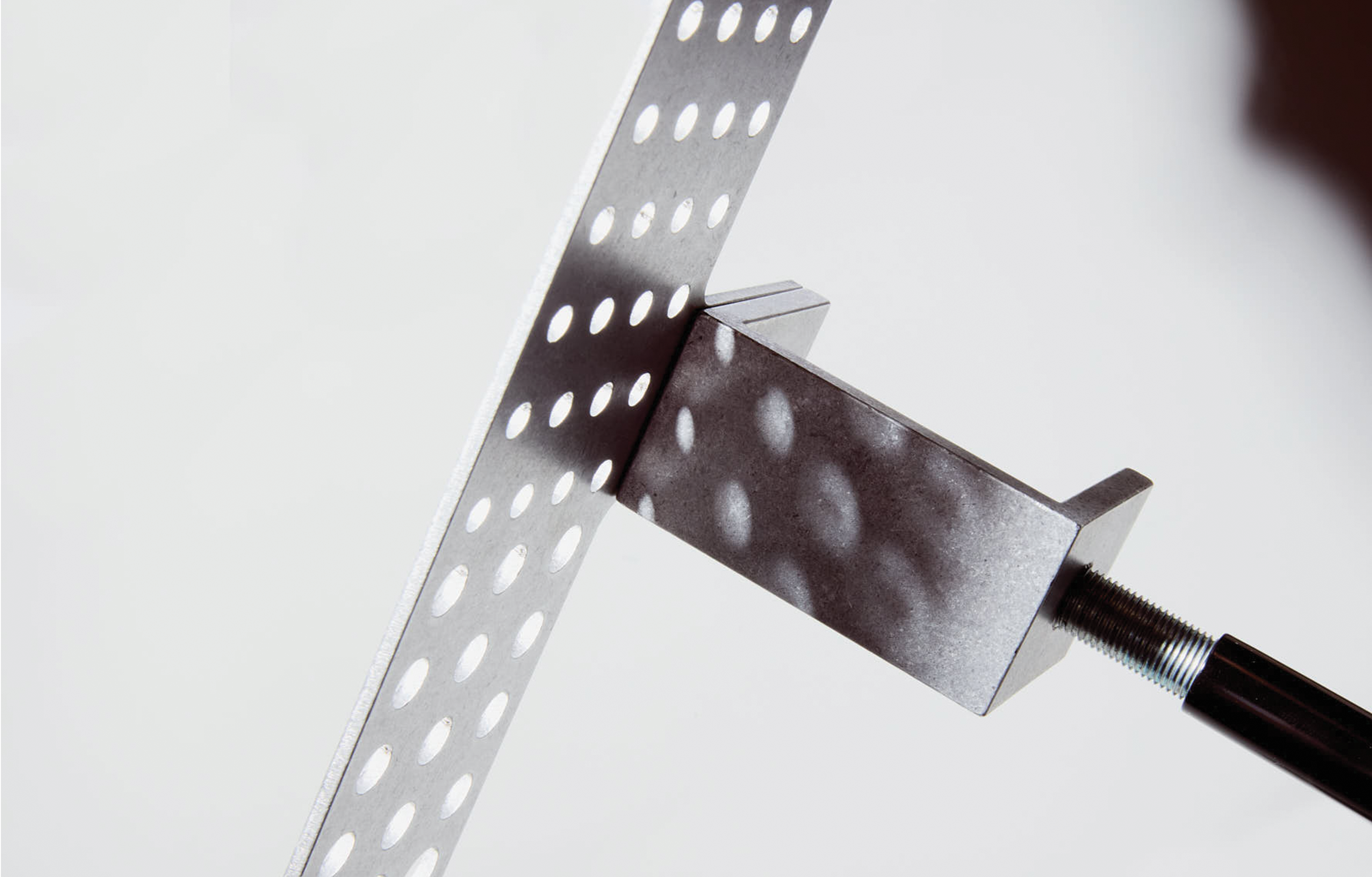 detail of aluminum paintbrush holder